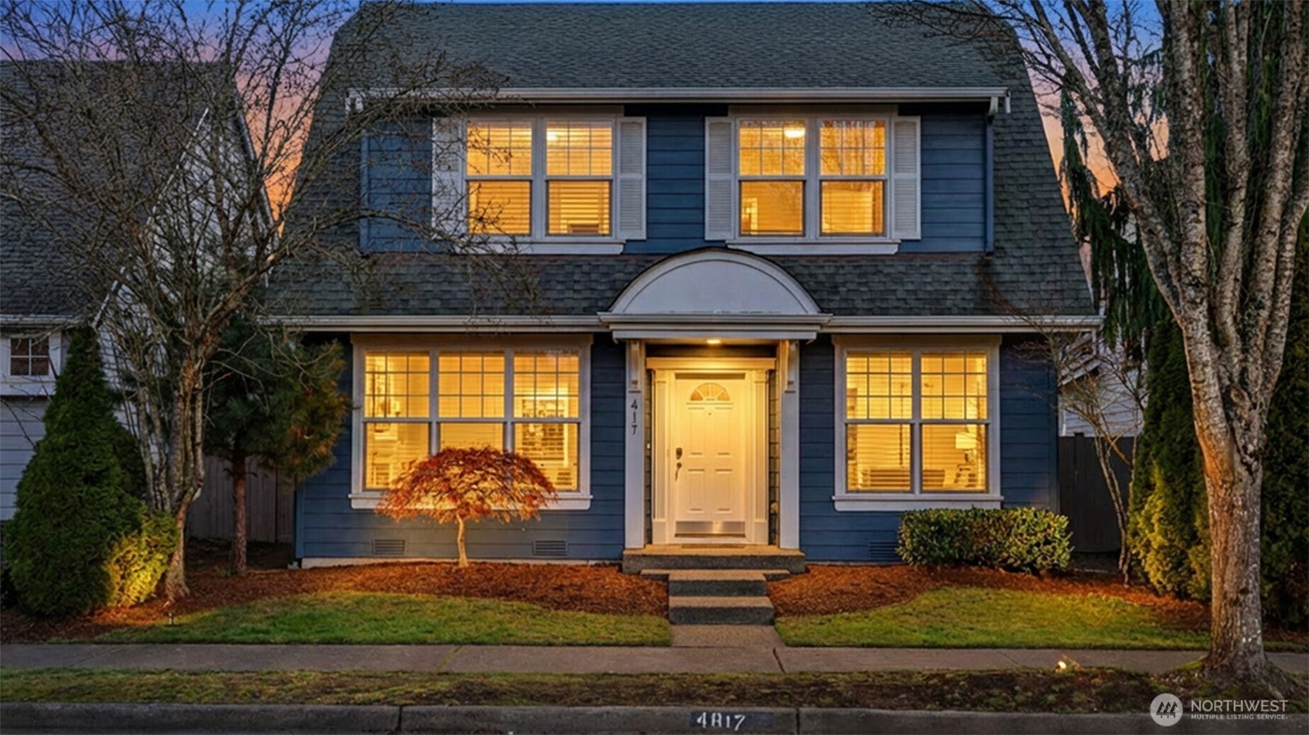 4817 Hartford Way Mukilteo, WA 98275 - Photo 2 of 36 a front view of a house with garden