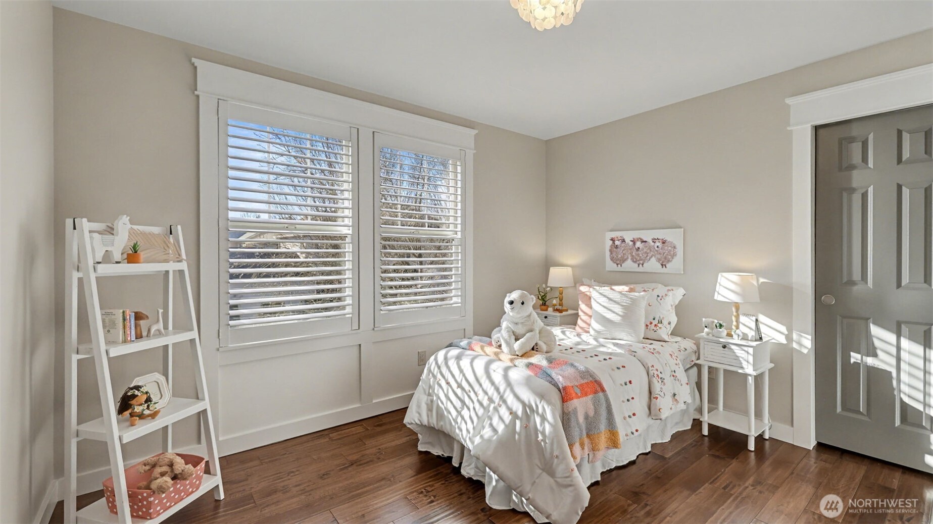 4817 Hartford Way Mukilteo, WA 98275 - Photo 22 of 36 a bedroom with a bed and wooden floor