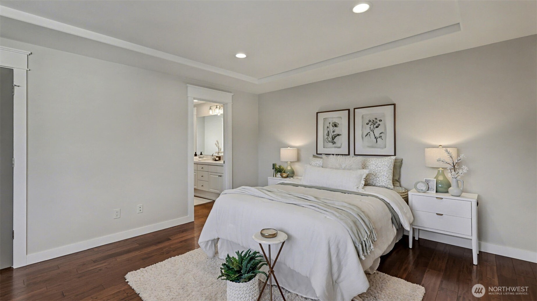 4817 Hartford Way Mukilteo, WA 98275 - Photo 27 of 36 a bedroom with a bed and wooden floor