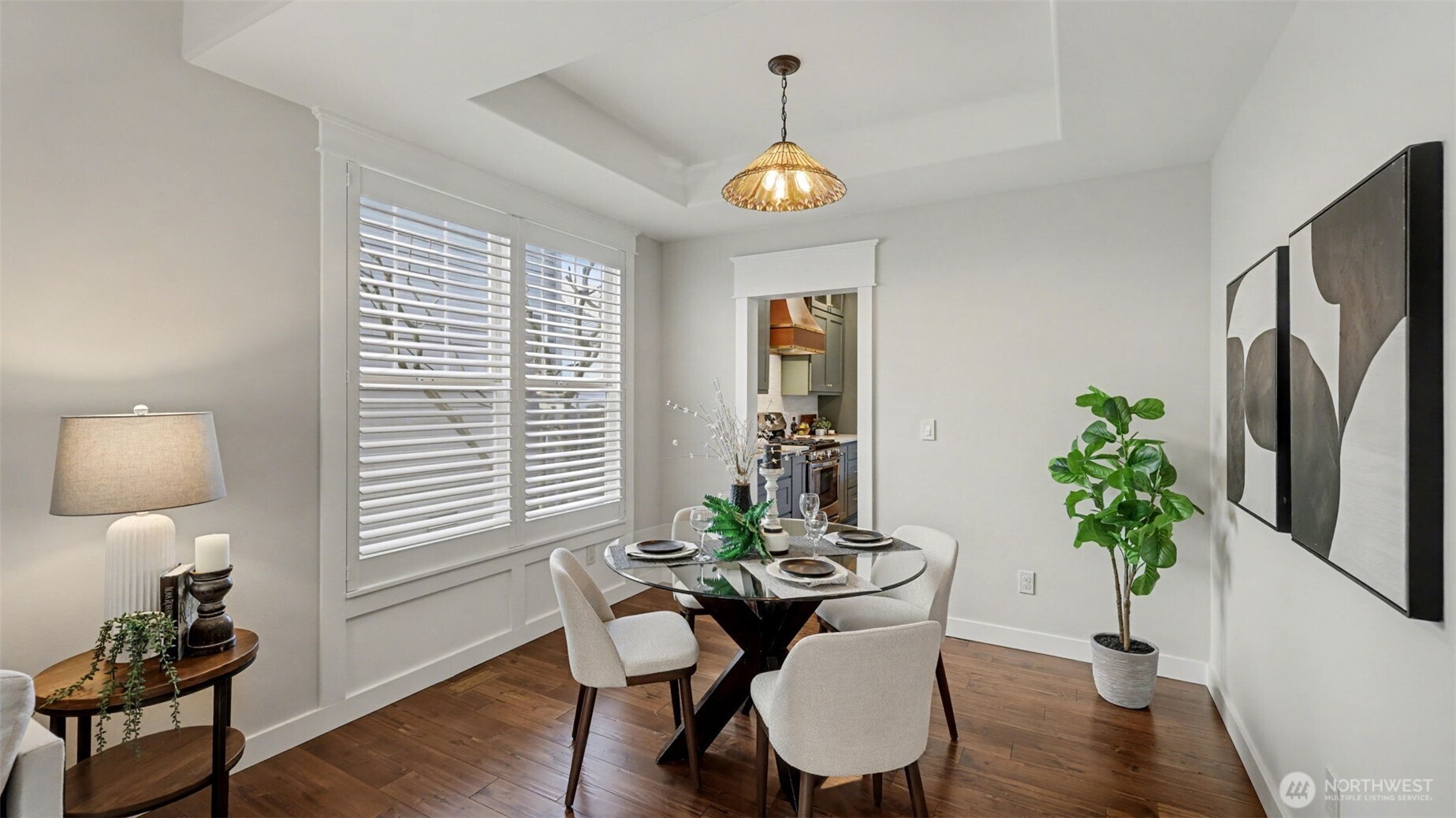 4817 Hartford Way Mukilteo, WA 98275 - Photo 10 of 36 a view of a dining room with furniture window and wooden floor