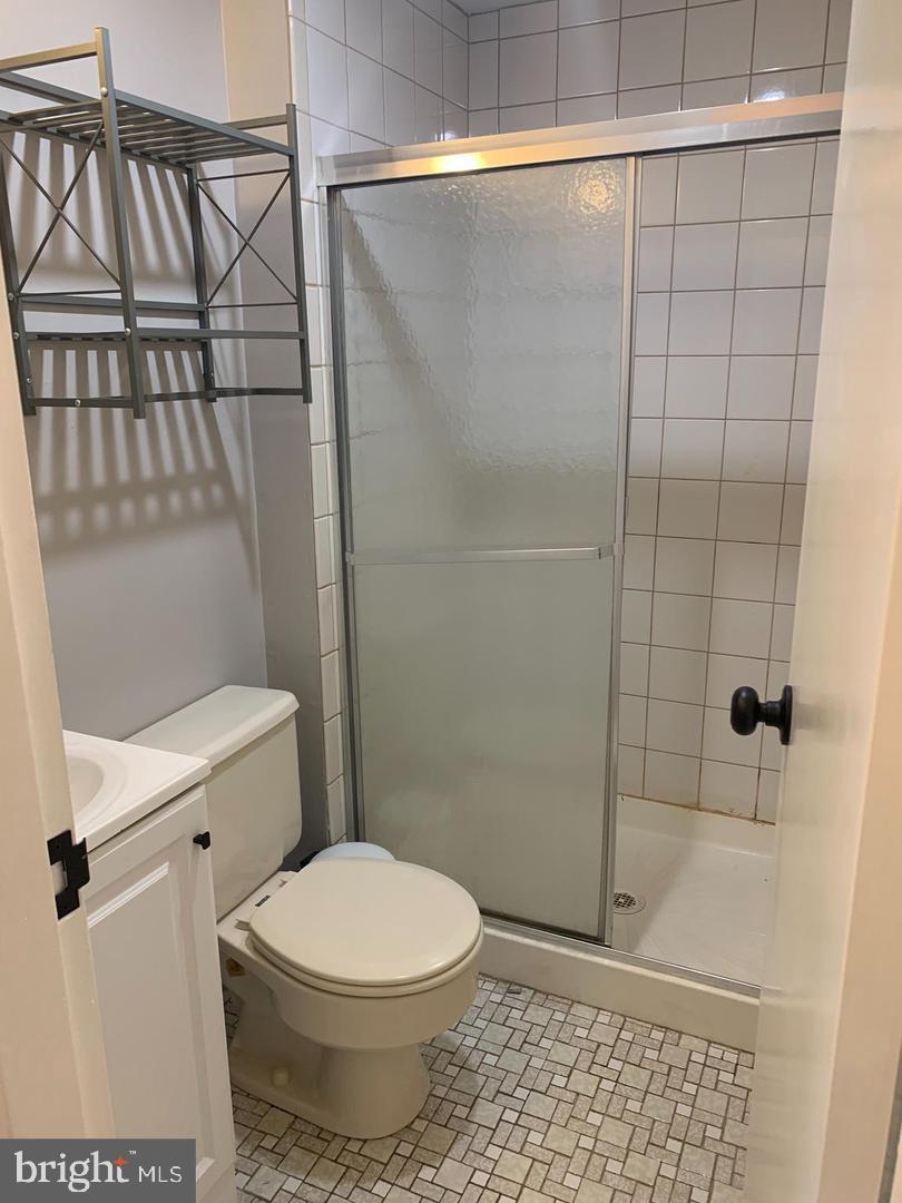 1018 Pine Street, Unit 2F Philadelphia, PA 19107 - Photo 11 of 12 a bathroom with a toilet and shower