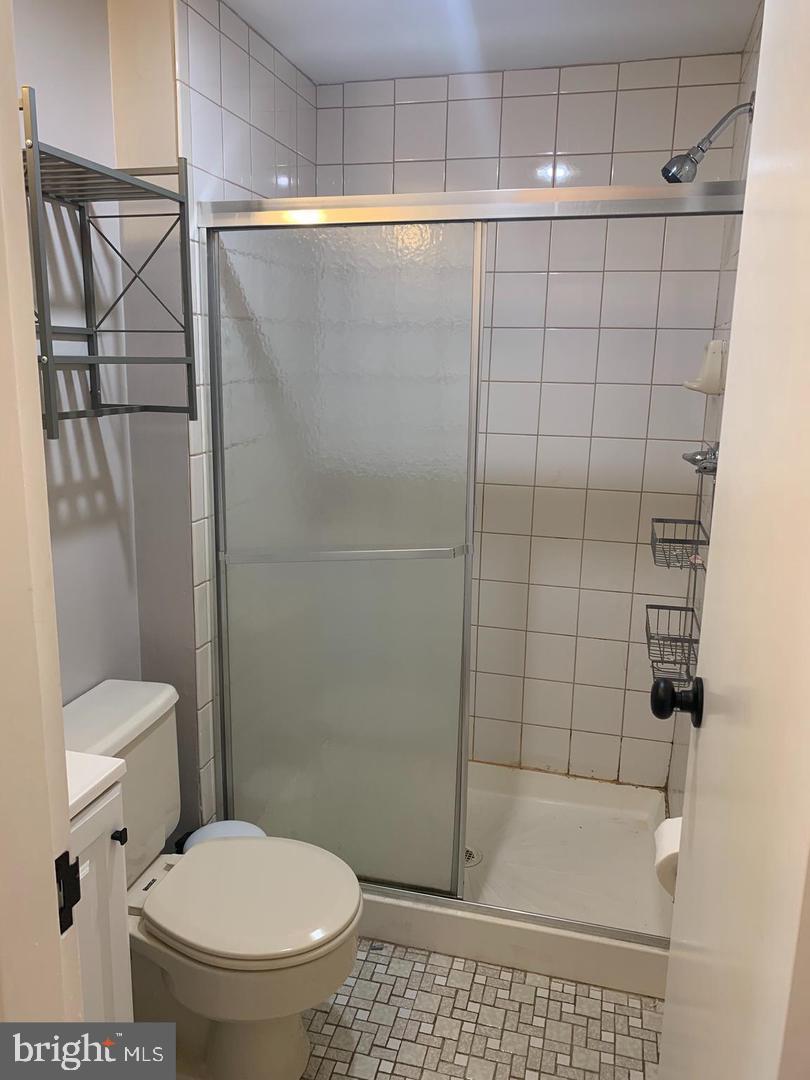 1018 Pine Street, Unit 2F Philadelphia, PA 19107 - Photo 12 of 12 a bathroom with a toilet and a shower