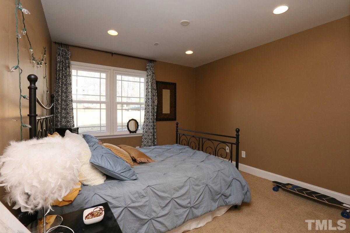8517 Shadow Wood Place Raleigh, NC 27613 - Photo 22 of 25 a bedroom with a bed and a window