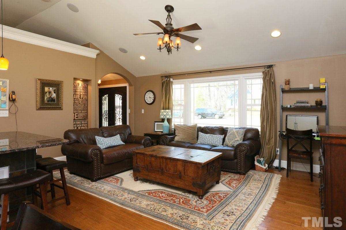 8517 Shadow Wood Place Raleigh, NC 27613 - Photo 5 of 25 a living room with furniture and a large window