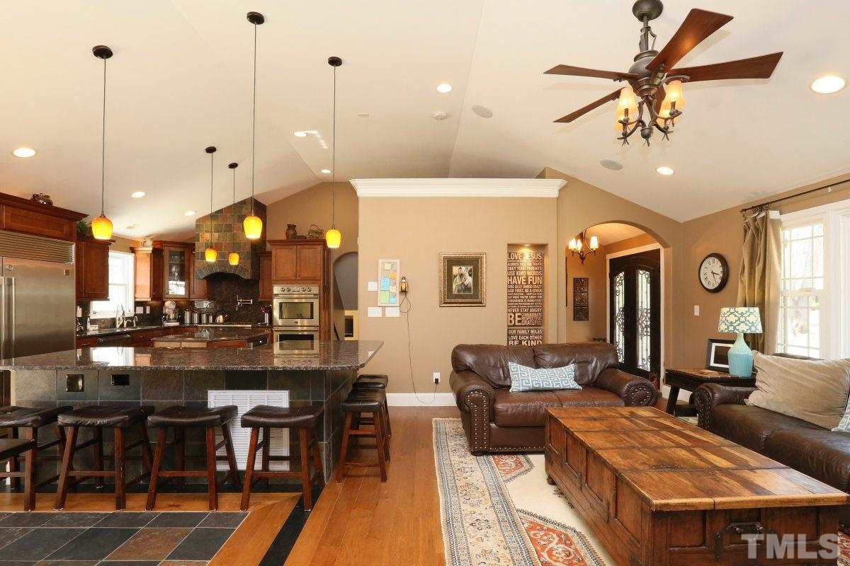 8517 Shadow Wood Place Raleigh, NC 27613 - Photo 6 of 25 a large kitchen with a table and chairs