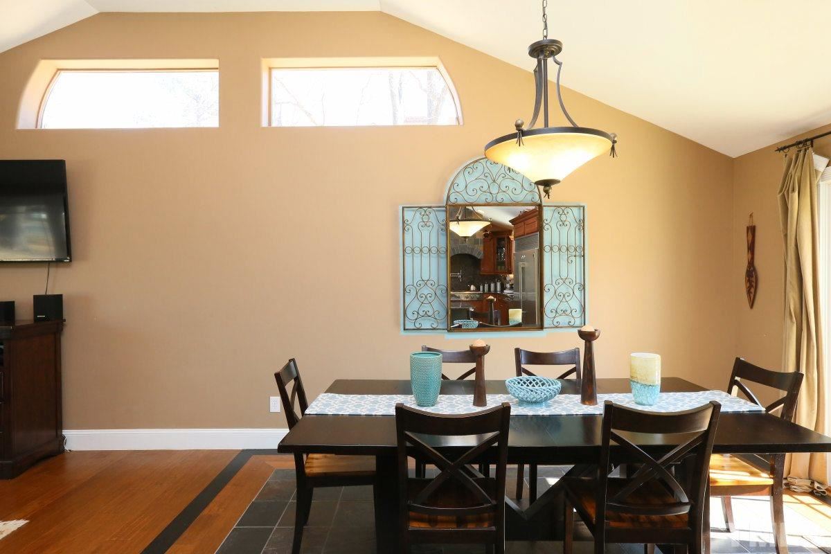 8517 Shadow Wood Place Raleigh, NC 27613 - Photo 10 of 25 a view of a dining room with a table and chairs