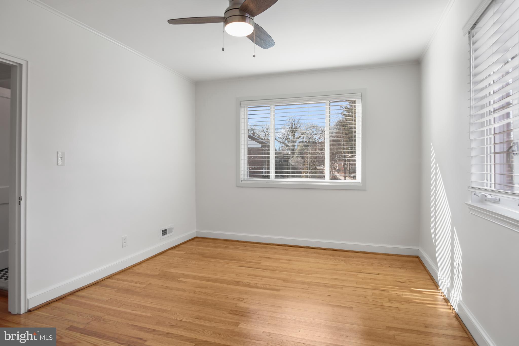 69 Aigburth Avenue Towson, MD 21286 - Photo 17 of 32 wooden floor in an empty room with a window