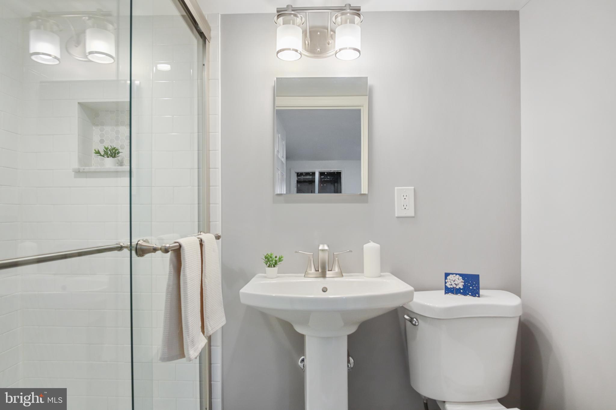 69 Aigburth Avenue Towson, MD 21286 - Photo 25 of 32 a bathroom with a sink a mirror and shower