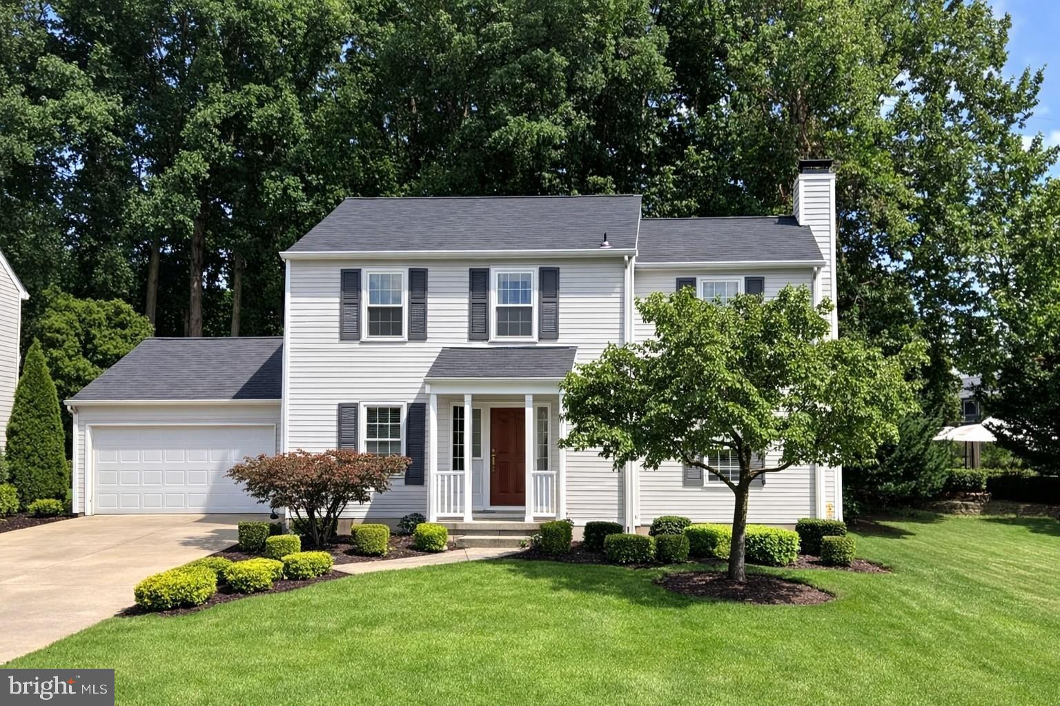 9405 Perglen Road Nottingham, MD 21236 - Photo 1 of 37 a front view of a house with a yard and trees