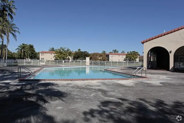 a view of swimming pool with a yard