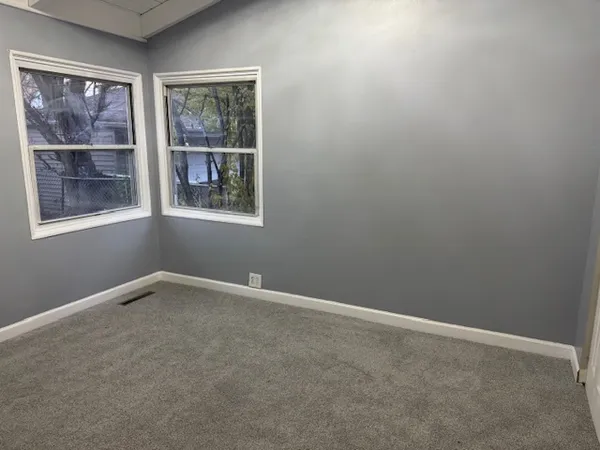 an empty room with windows