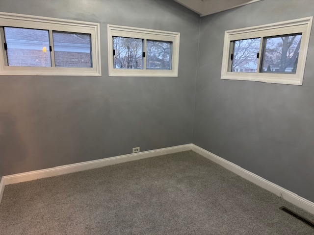 7100 Wilson Terrace Morton Grove, IL 60053 - Photo 10 of 15 an empty room with windows