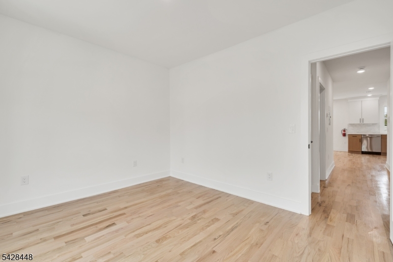 196 Taylor Street Orange, NJ 07050 - Photo 14 of 31 a view of a room with wooden floor
