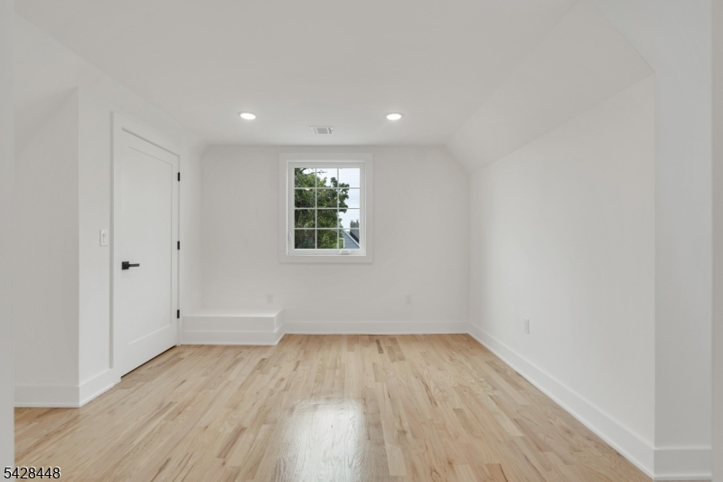196 Taylor Street Orange, NJ 07050 - Photo 23 of 31 wooden floor in an empty room with a window