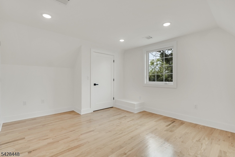 196 Taylor Street Orange, NJ 07050 - Photo 24 of 31 an empty room with wooden floor and windows