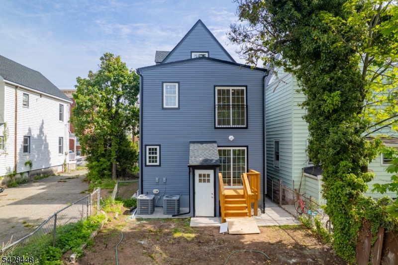 196 Taylor Street Orange, NJ 07050 - Photo 28 of 31 a front view of a house with garden