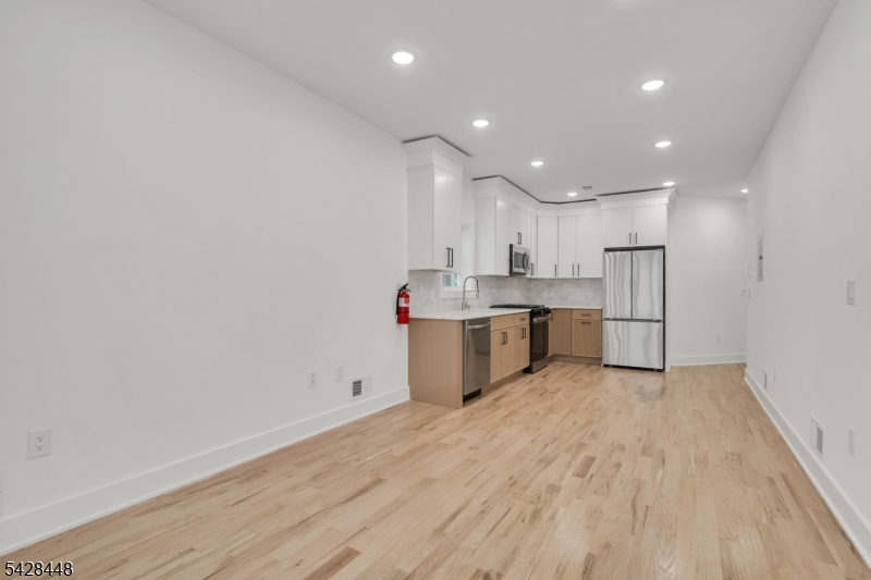 196 Taylor Street Orange, NJ 07050 - Photo 3 of 31 a view of kitchen with wooden floor