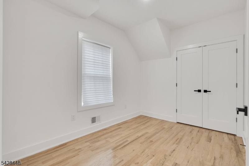 196 Taylor Street Orange, NJ 07050 - Photo 5 of 31 a view of an empty room with a window