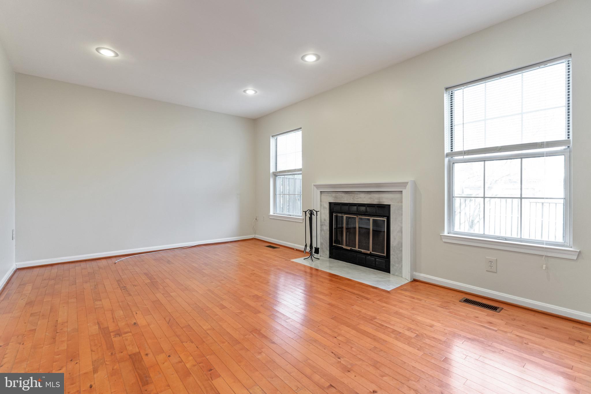 1558 Hugo Circle Silver Spring, MD 20906 - Photo 11 of 31 Living room with wood burning fireplace