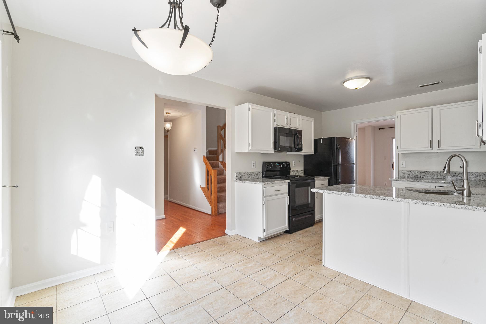 1558 Hugo Circle Silver Spring, MD 20906 - Photo 6 of 31 Spacious kitchen - breakfast bar