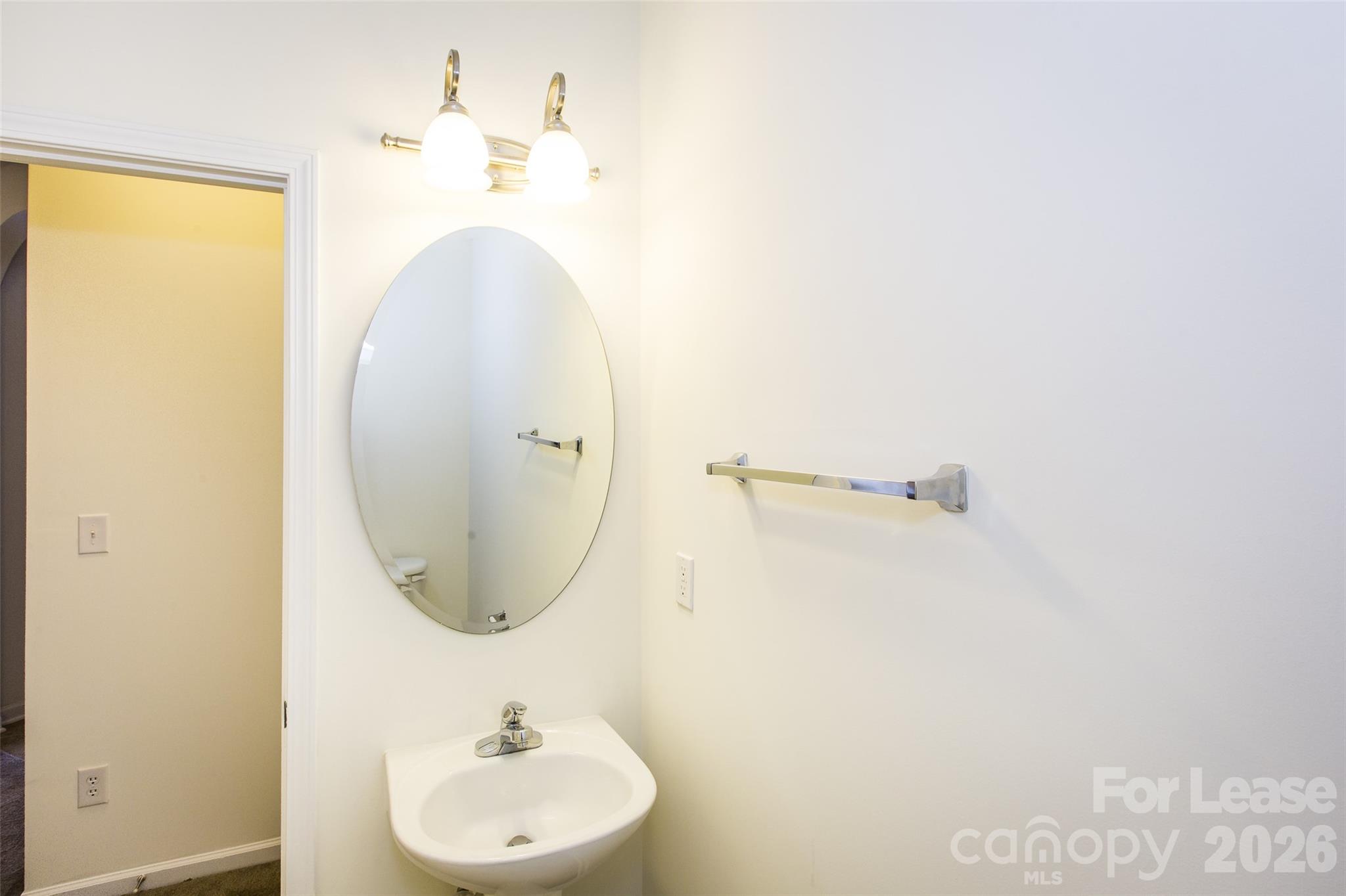 13422 Erwin Road Charlotte, NC 28273 - Photo 12 of 35 a bathroom with a sink a mirror and vanity