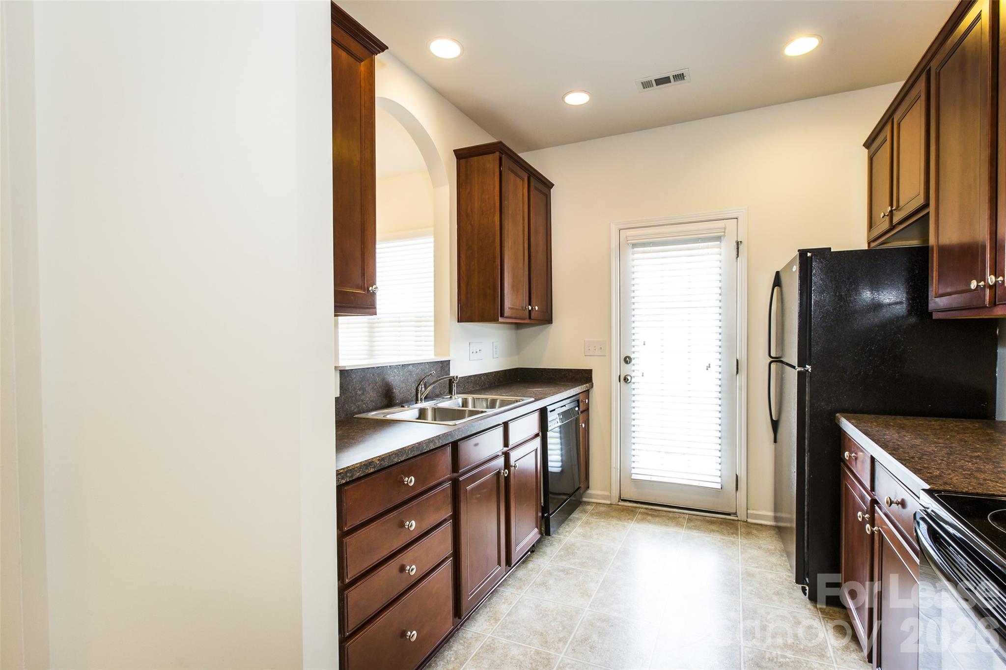 13422 Erwin Road Charlotte, NC 28273 - Photo 14 of 35 a kitchen with stainless steel appliances granite countertop a stove a refrigerator and a sink