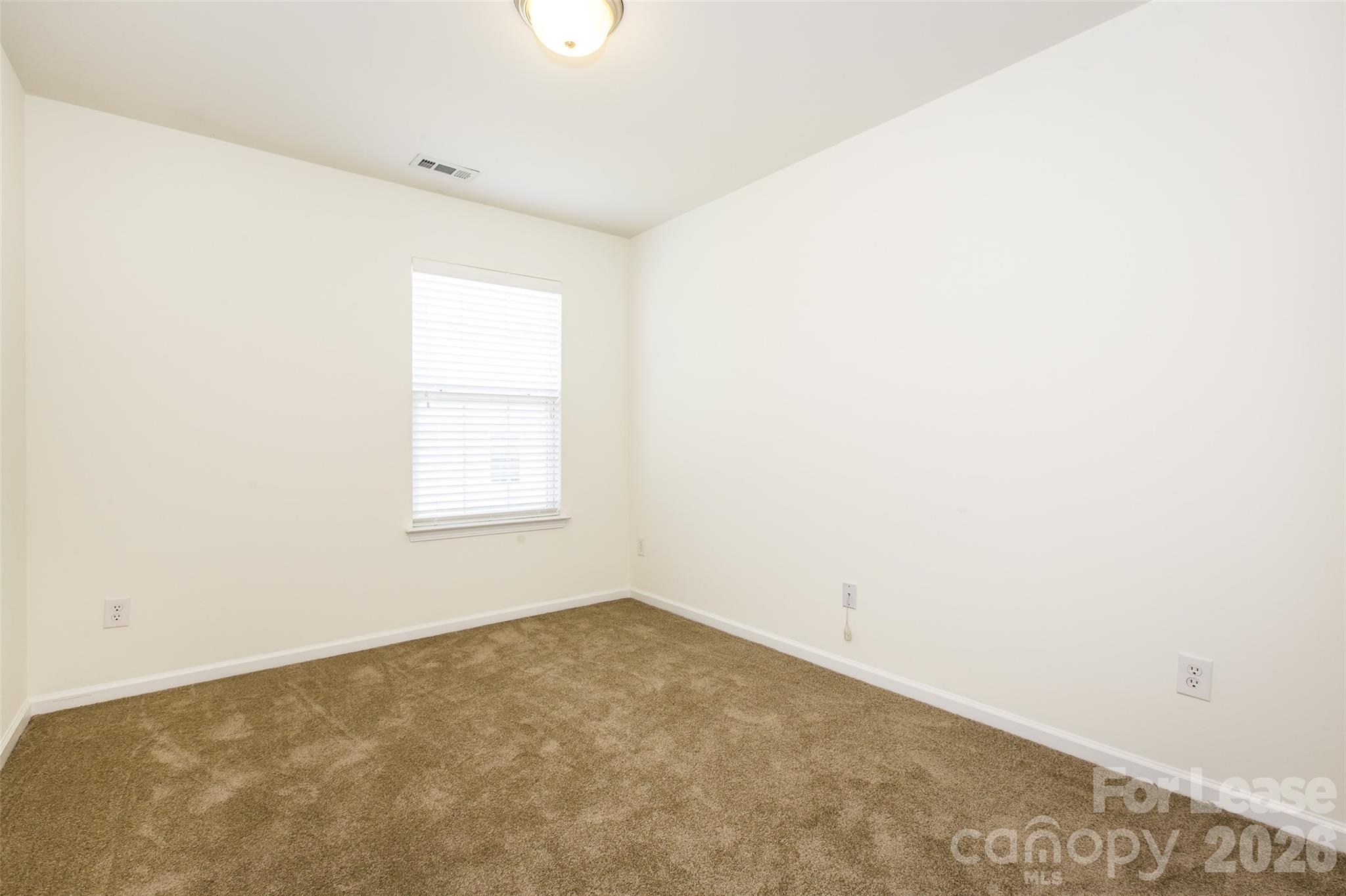 13422 Erwin Road Charlotte, NC 28273 - Photo 26 of 35 an empty room with a window