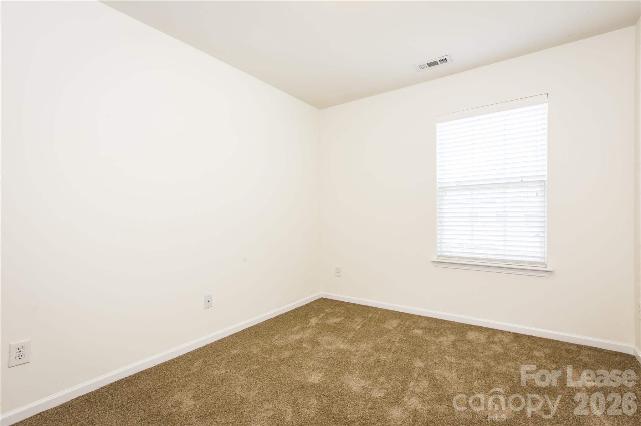 13422 Erwin Road Charlotte, NC 28273 - Photo 27 of 35 an empty room with a window