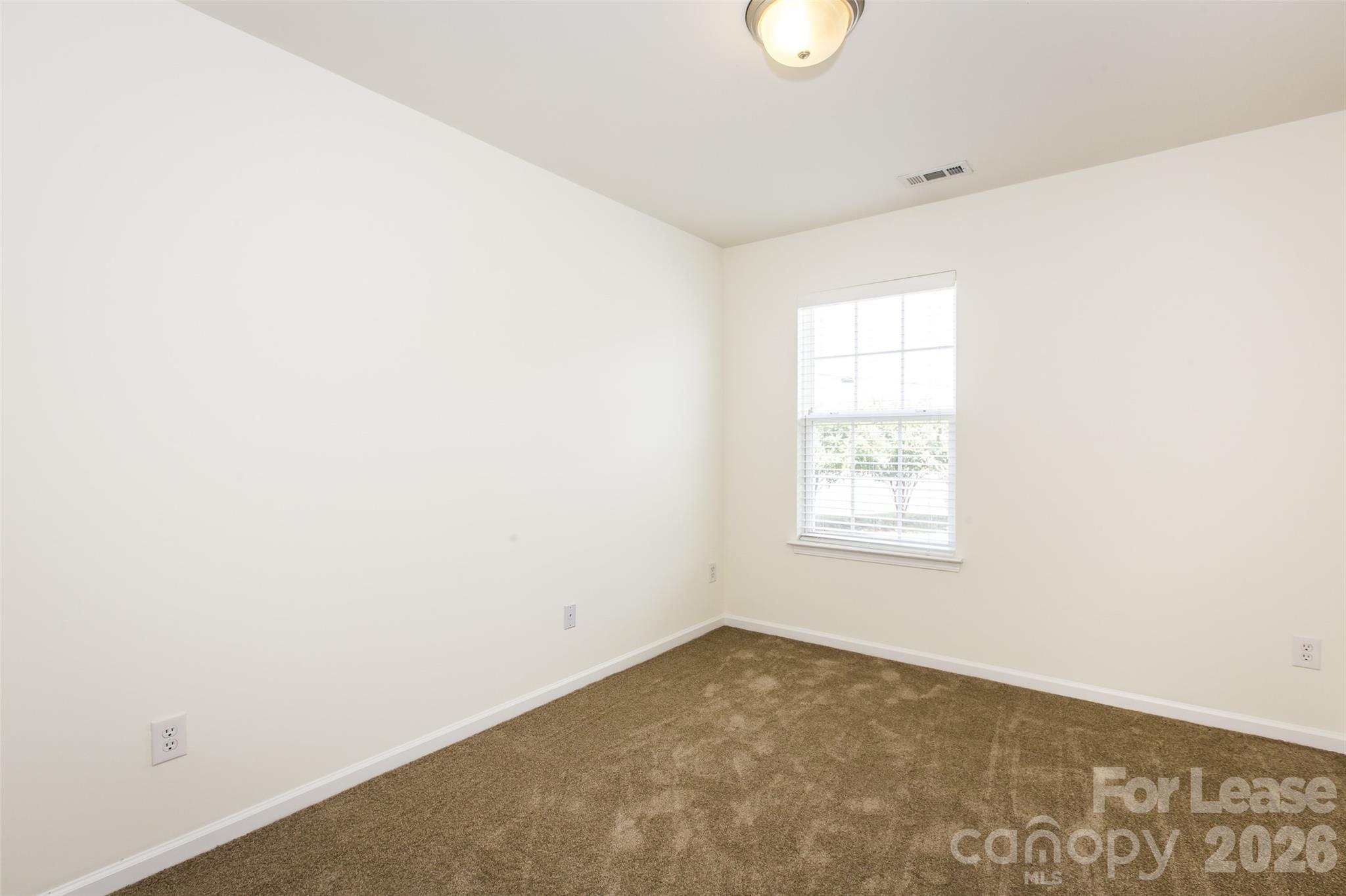 13422 Erwin Road Charlotte, NC 28273 - Photo 30 of 35 a view of a room that has a window in it