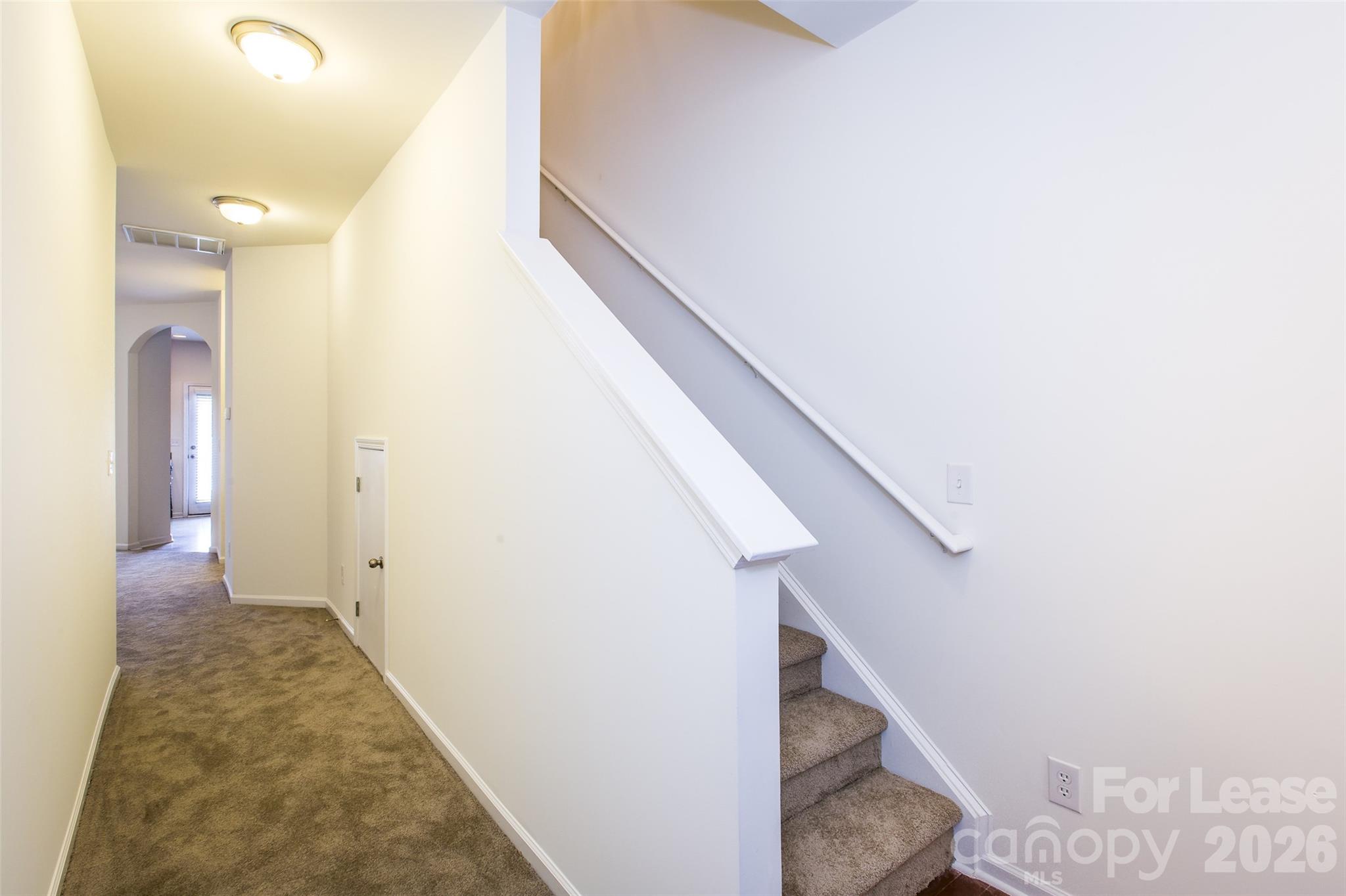 13422 Erwin Road Charlotte, NC 28273 - Photo 5 of 35 a view of a hallway with stairs