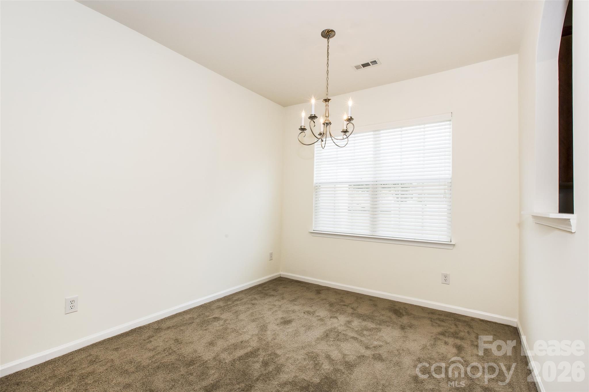 13422 Erwin Road Charlotte, NC 28273 - Photo 10 of 35 a view of an empty room with a window