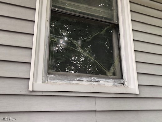 1435 Rockefeller Road Wickliffe, OH 44092 - Photo 6 of 48 Damaged window on south side of house