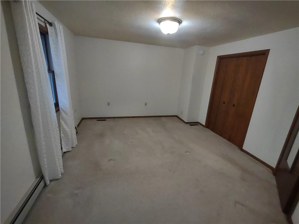 4641 Ellwood Road New Castle, PA 16101 - Photo 14 of 26 an empty room with windows