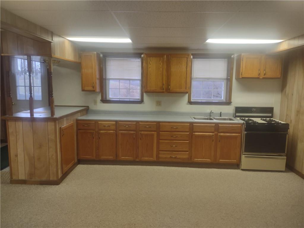 4641 Ellwood Road New Castle, PA 16101 - Photo 21 of 26 a kitchen with stainless steel appliances granite countertop a stove a sink and a microwave