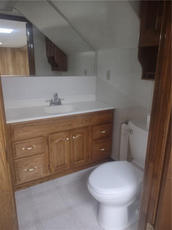 4641 Ellwood Road New Castle, PA 16101 - Photo 22 of 26 a bathroom with a toilet a sink and mirror