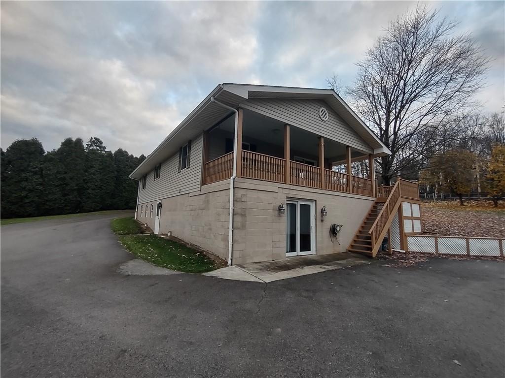 4641 Ellwood Road New Castle, PA 16101 - Photo 25 of 26 a view of a wooden house with a large trees