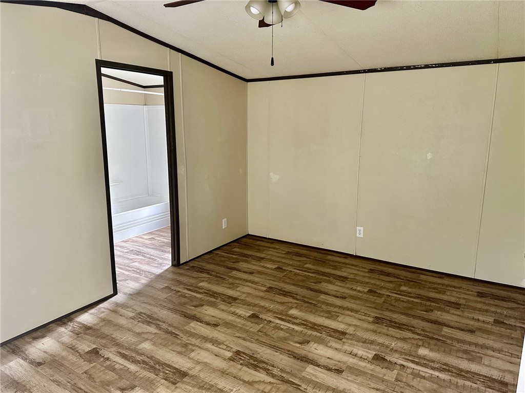 1522 16th Street, Unit 6 Rockport, TX 78382 - Photo 7 of 12 a view of empty room with wooden floor