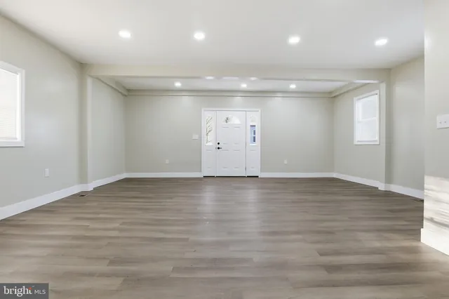 a kitchen with stainless steel appliances a refrigerator sink and microwave