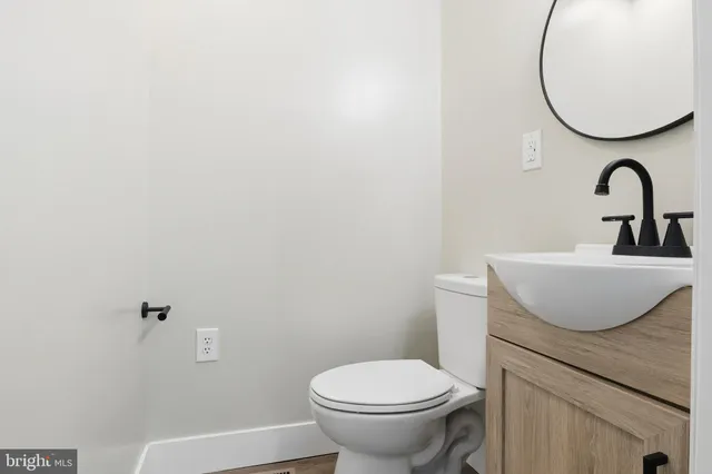 a bathroom with a toilet sink and shower