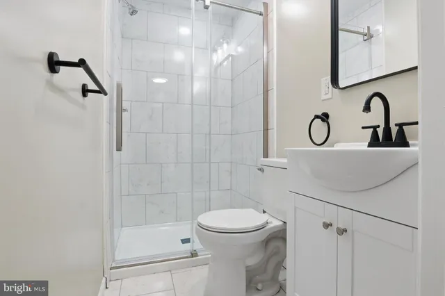 a view of a house with snow on the side of the road