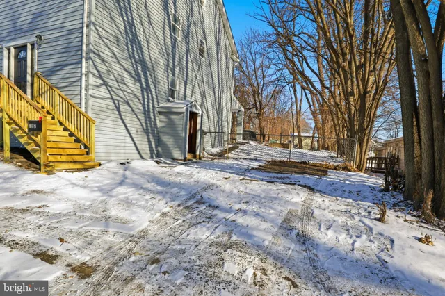 a view of outdoor space with deck and tree