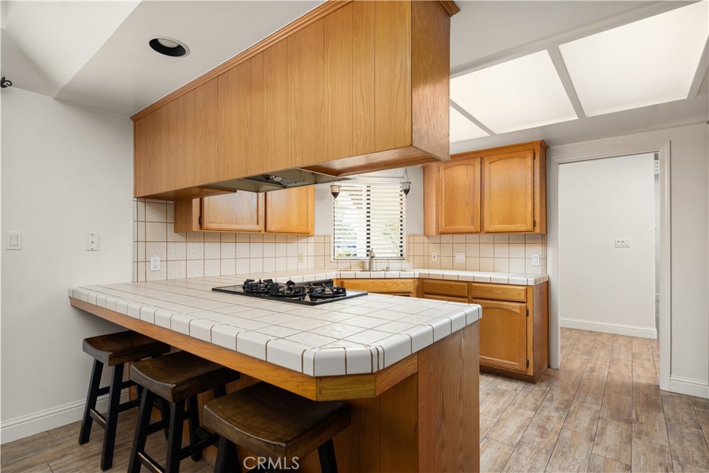 2119 Jenkins Road Bakersfield, CA 93314 - Photo 14 of 35 a kitchen with granite countertop a sink and a stove