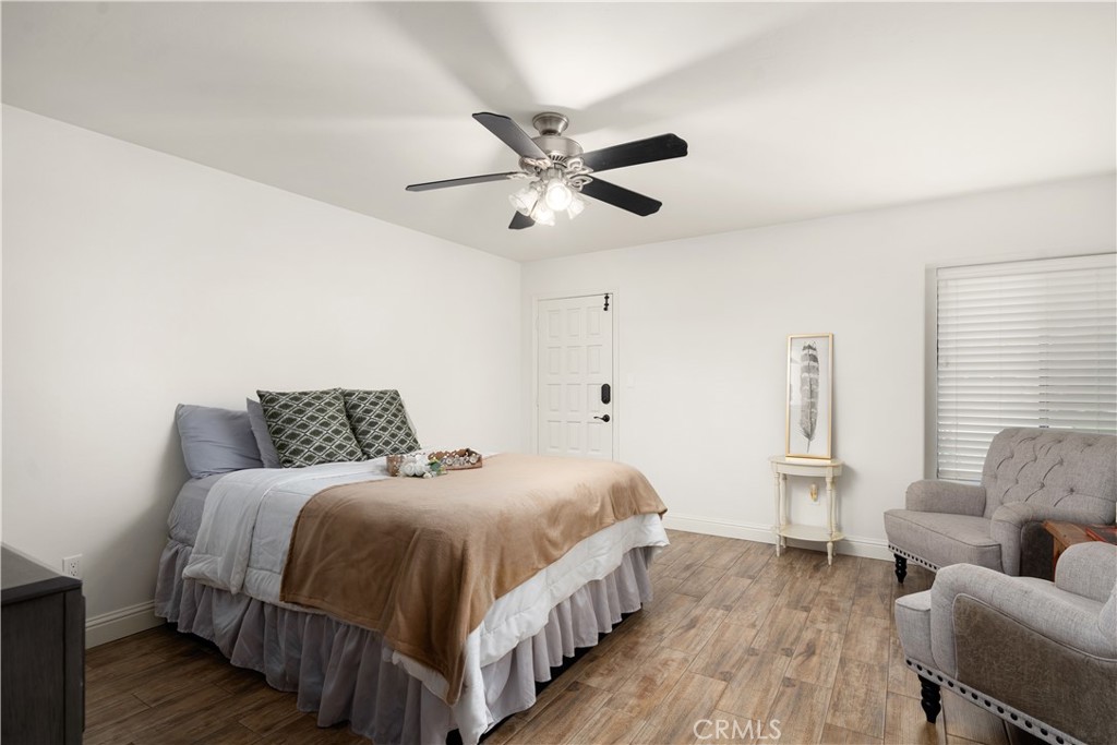 2119 Jenkins Road Bakersfield, CA 93314 - Photo 17 of 35 a bedroom with bed and a couch