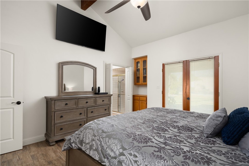 2119 Jenkins Road Bakersfield, CA 93314 - Photo 23 of 35 a bedroom with a large bed and a flat tv screen on dresser