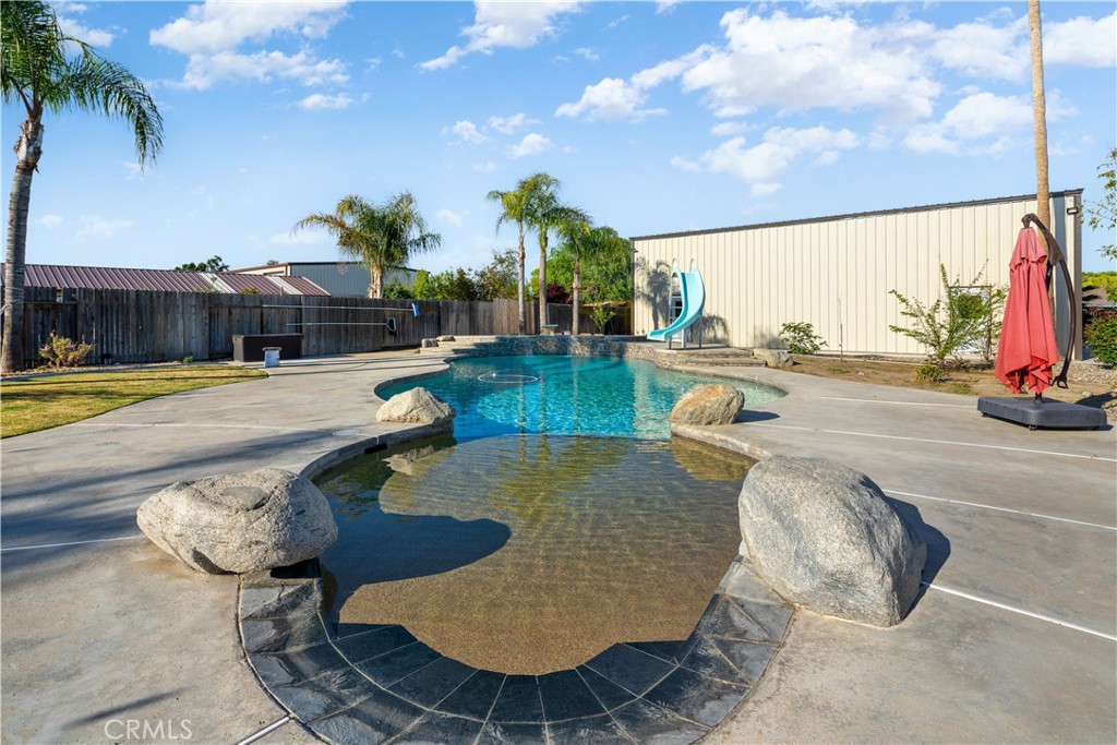 2119 Jenkins Road Bakersfield, CA 93314 - Photo 5 of 35 a view of a swimming pool with lounge chairs