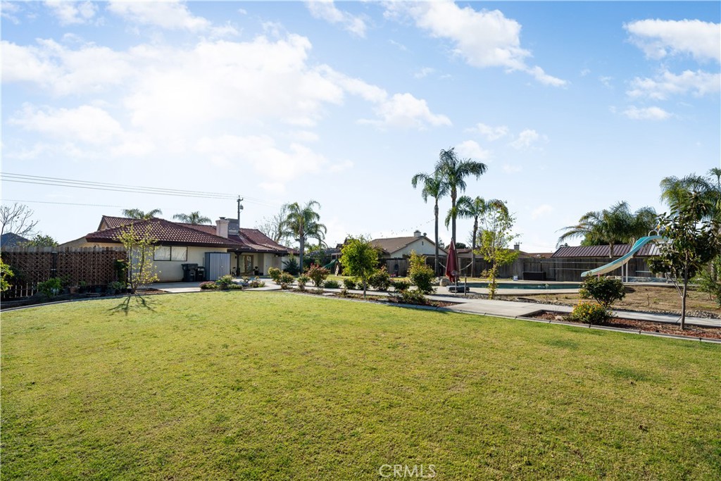 2119 Jenkins Road Bakersfield, CA 93314 - Photo 7 of 35 a view of a swimming pool with a yard and a terrace