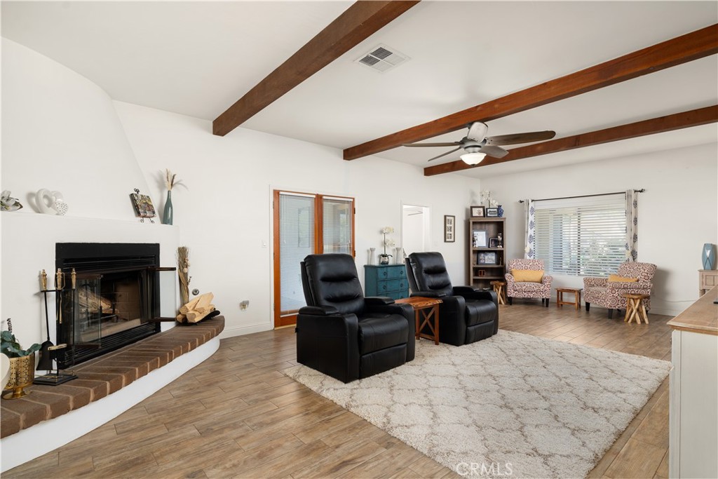 2119 Jenkins Road Bakersfield, CA 93314 - Photo 9 of 35 a living room with furniture and a fireplace