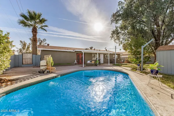 a view of a swimming pool with a patio