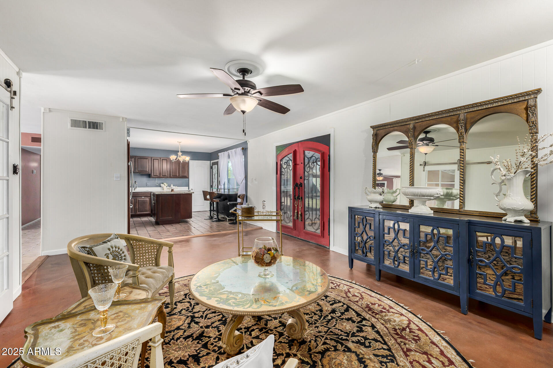 2302 West Berridge Lane Phoenix, AZ 85015 - Photo 13 of 40 a dining room with wooden floor and a chandelier
