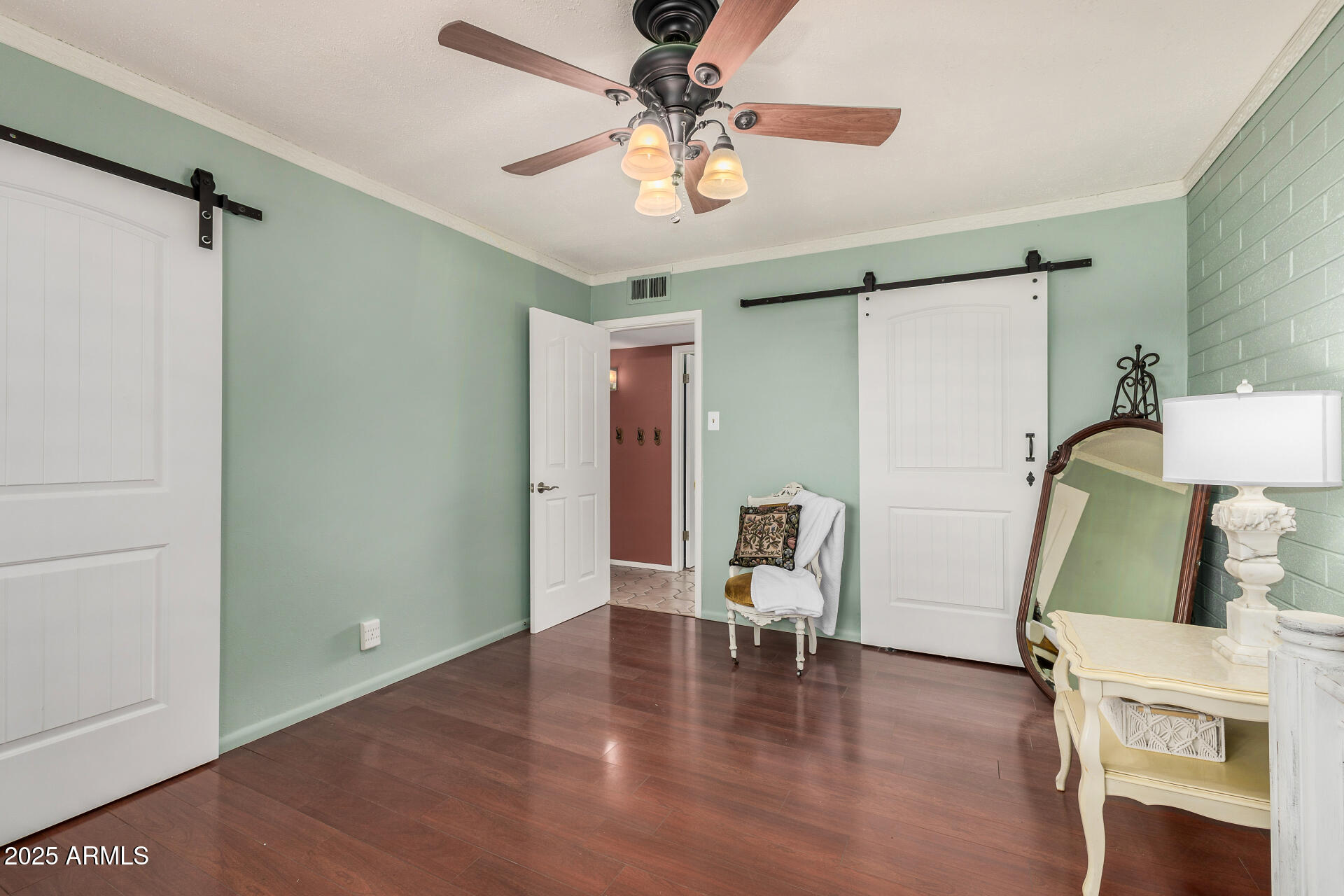 2302 West Berridge Lane Phoenix, AZ 85015 - Photo 18 of 40 a view of a livingroom with wooden floor and a ceiling fan